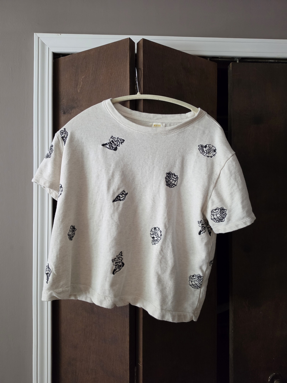 Anthropologie Cream Short-Sleeve Tee with Black Embroided Shells